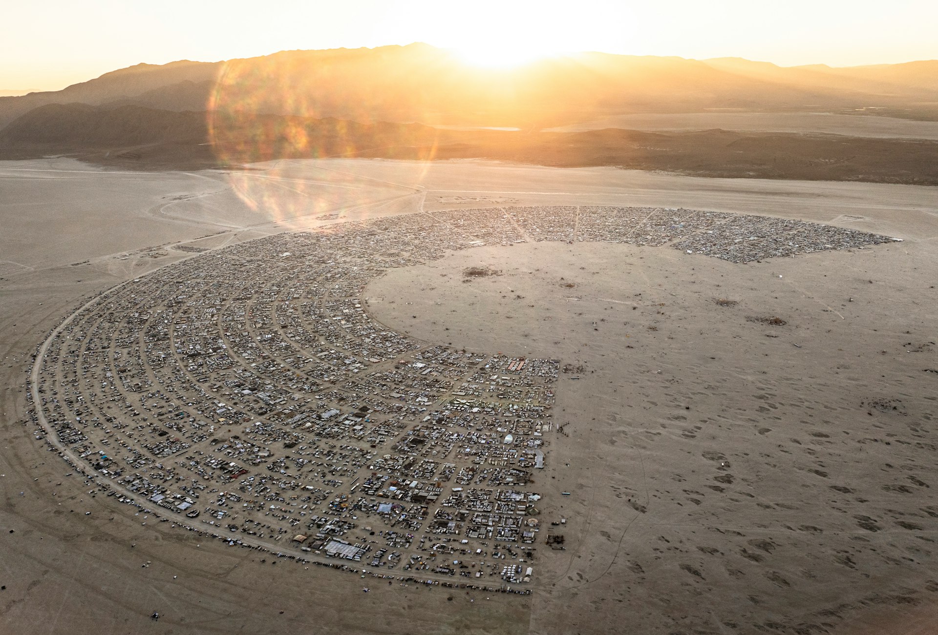 An aerial view of a desert with a circle in the middle
